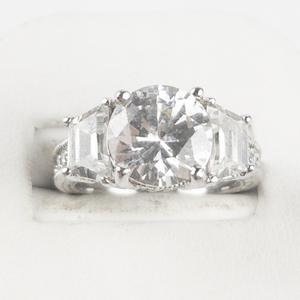 lot 86 image: Intricate Round Cut CZ 3 Stone Sterling Silver Engagement Style Ring. Size 7 - 7.25.