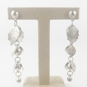 lot 131 image: Leafy Silver Tone Base Metal Dangle Earrings .