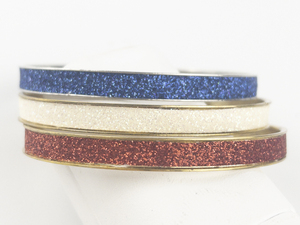 lot 173 image: Group of 3  Red, White, & Blue Sparkling Base Metal Bangles.
