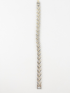 lot 179 image: Two-Tone Chevron Base Metal Link Bracelet.