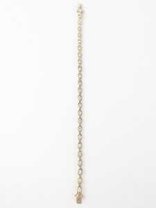 lot 180 image: X & OS CZ Gold Tone Base Metal Tennis Bracelet.