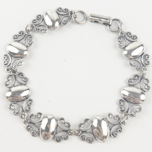 lot 182 image: Art Deco Filigree Sterling Silver Link Bracelet.