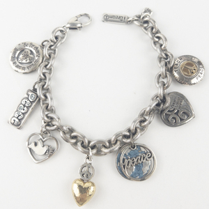 lot 192 image: Peace Silver Tone Base Metal Charm Bracelet.