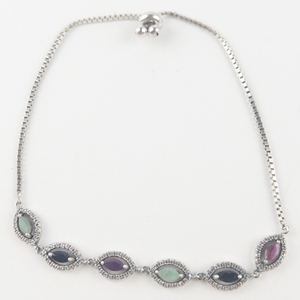 lot 201 image: Ruby, Emerald, Sapphire, & CZ  Silver Tone Base Metal Bracelet.