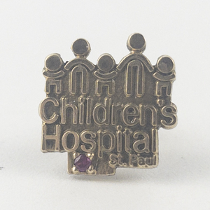 lot 216 image: Tharpe Co Childrens Hospital Set With Red Stone Yellow Base Metal Lapel Pin.