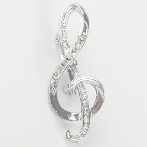 lot 220 image: Rhinestone Accented Music Treble Clef Silver Tone Base Metal Brooch .