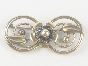 lot 227 image: Louis Stern Co.  Vintage Blue Rhinestone Leaf Swirl Gold Filled Brooch .