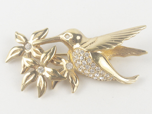 lot 252 image: Swarovski Rhinestone Accented Hummingbird & Flowers Gold Tone Base Metal Brooch .