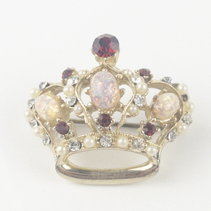 lot 258 image: Pearl, Rhinestone, & Created Opal Accented Crown Gold Tone Base Metal Brooch .