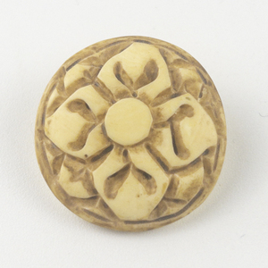 lot 303 image: Painted Carved Ceramic pendant (no chain).