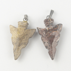 lot 305 image: Set of two  stone arrow head pendants (no chain).