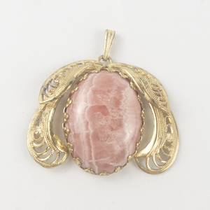 lot 312 image: West Germany  Rhodochrosite Cabochon Filigree gold tone base metal pendant (no chain).