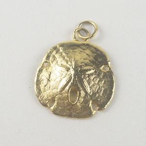 lot 313 image: Textured Sand Doller gold tone base metal pendant (no chain).