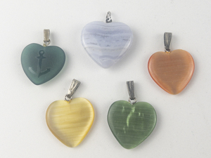lot 319 image: Group of 5  Different color heart silver tone base metal pendants (no chain).