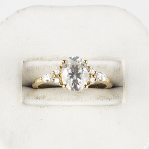 lot 1 image: 14k Yellow Gold Engagement Ring - 1.5ct Oval Moissanite & Natural diamond accents. Estimated Replacement Value $2000 LIKE NEW