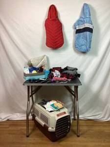 lot 141 image: Dog Bundle - Portable Dog Kennel, Dog Grooming Table, Grooming Tools, Books, Dog Jackets and Booties