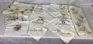 lot 47 image: Vintage Embroidered and Cross Stitch Linens - Tableclothes, tea towel and Days of the Week Flour Sack Towels