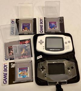 lot 224 image: Game Boy Advance with 4 Game Boy Games and Case