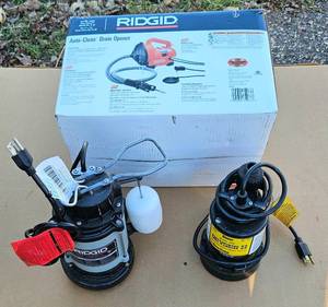lot 234 image: Two Sump Pumps and Electric Auto Clean Drain Opener