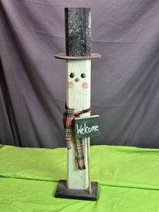 lot 11 image: Handcrafted Wooden Snowman Figurine with Plaid Scarf and Welcome Sign