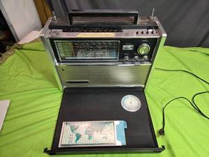 lot 15 image: Vintage National Panasonic RF-5000 Portable Radio Receiver with Time Table and Map