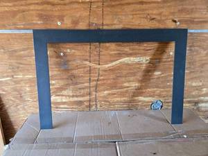 lot 180 image: Heavy-Duty Black Metal Fireplace Frame for Custom Use