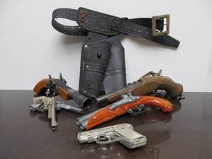 lot 55 image: Group of Vintage Cap Guns 