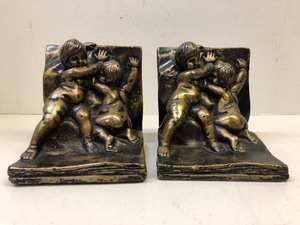 lot 311 image: Antique Brass or Bronze Fighting Cherubs Bookend Set