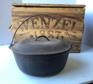 lot 338 image: Large Cast Iron Dutch Oven wWENZEL Cast Iron Wooden Advertising Crate
