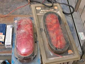 lot 763 image: Lot of (2) Trailer Lights - IIT Submersible Red 6 LED Trailer Light, Blazer 6 Oval Stop  Tail Turn Light Kit 6-plug (New )