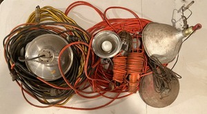 lot 25 image: Five Extension Cords, Three Light Fixtures, 2 Handheld Shop Lights