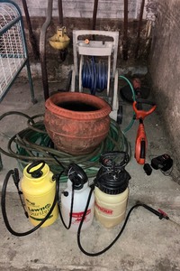 lot 60 image: Gardening LOT - Grasshopper Cordless Weed Wacker, Hose Reel, Garden Hose, Sprayers, Planter