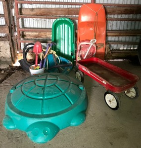lot 84 image: Kids Outdoor Play LOT - Radio Flyer 18 Wagon, Two Sleds, Turtle Sandbox, Two Baby Swings, Tire Tree Swing, Kids Garden Tools