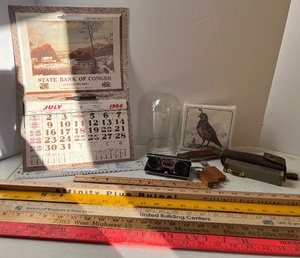 lot 232 image: Junk Drawer Lot Vintage Calendar, Yard Sticks, Swift Survey Pocket Scope with Level