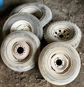 lot 272 image: Five Rims with Tires - Implement and Auto
