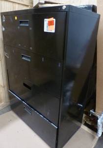 Two file cabinets 4 drawer lateral and 4 drawer vertical