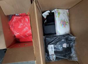Two boxes full of clothing