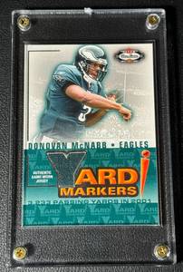 lot 54C image: Donovan McNabb Game Worn Relic 2002 Fleer BOx Sxores Yard Markers Football Card