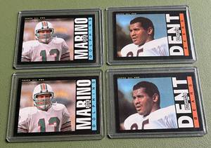 lot 122D image: 1985 Topps (2) Richard Dent RCs #24 and (2) Dan Marino 2nd Year #314 - Vintage Football Cards