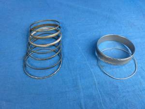 lot 50 image: 9 Silver-Color Bangle Bracelets