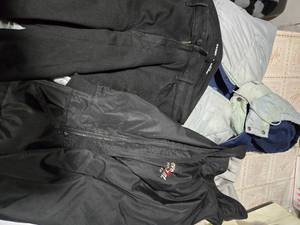 lot 25 image: Two 2XL Jackets (One is double sided, and the other is just black) and a Size 16 Black Old-Navy Long Jean (3 items in all)