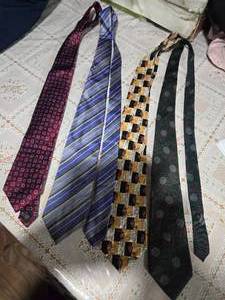 lot 26 image: Four High Profile Brand Neckties ( J.z. Richards for Nordstrom Jos A. Bank Executive Collection, Adolfo Culture, and Mario Valentino)