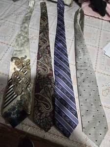 lot 28 image: Four High Profile Brand Neckties (  Valmntino Cravatte, TD Don Doral Originals RN 20041, ENRO Since 1919 Jacques Estier 100% Italiean Silk)