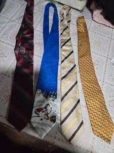 lot 30 image: Four High Profile Brand Neckties ( Stanford Executive, Dr. Seuss, Alby, and Nautica Neckties)