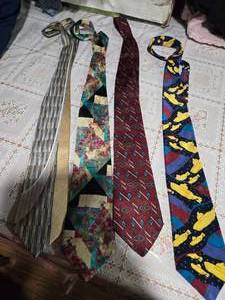 lot 32 image: Four High Profile Brand Neckties ( Standford Executive, Caravaggio Pure Italian Silk, Barrington and the Beatles Neckties)