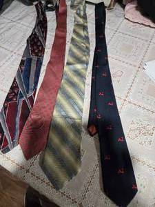 lot 39 image: Four High Profile Brand Neckties  ( Burma Bibas, Kleinhans, Burma Bibas, and unbranded Neckties)
