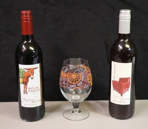 lot 206 image: Gift-ItPrairie Berry Red Ass Rhubarb and Cranberry Wine South Dakota Winery Two-Unopened 750ml BottlesStemware Special Edition from the New Belgium Brewery Colorado