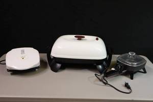 lot 217 image: Black and Decker Electric Covered Frying Pan, Continental Electric Mini Frying Pan, George Foreman Lean Mean Fat Grilln Machine
