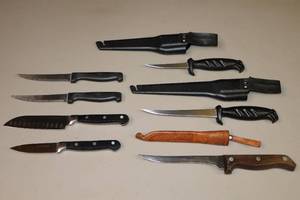lot 234 image: Assorted Knives (2) Rapala Filet, (2) Cuisinart 40043 ParingSerrated, (2) SS Steak, (1) Weber Knives Filet USA wLeather Tooled Sheath Made in Finland