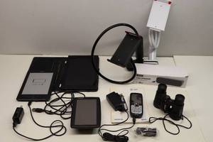 lot 299 image: Kindle, NotePad, Zetiy USB Speaker, Nokia CellPhone, TomTom Navigation, Funky Phone Grips Etc